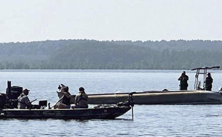 No one was injured when a barge ooverturned on Black Lake on Memorial Day.