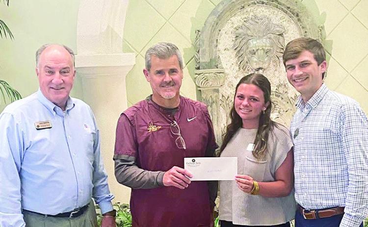 Exchange Bank is proud to sponsor the Natchitoches Central High School football. The bank donated funds to the program and wish the Chiefs good luck this season. From left are Exchange President Mike Newton, NCHS Coach Brad Laird, Eva Gonzales and Hunter Rabalais.
