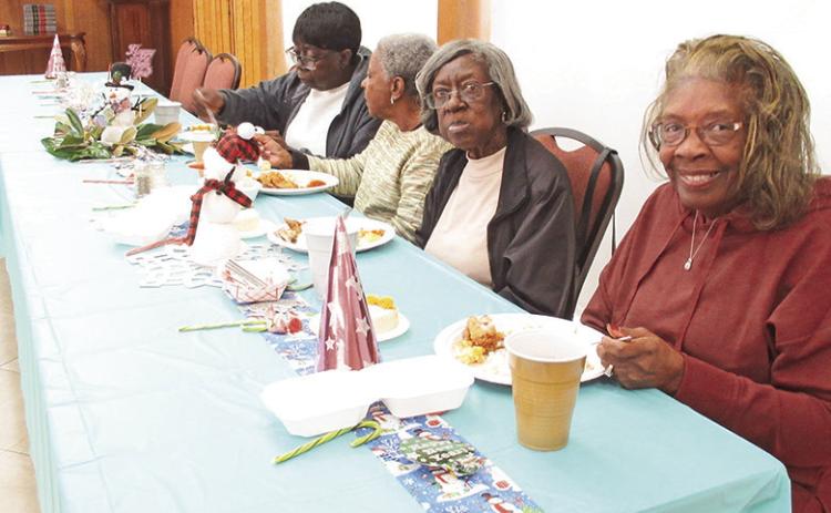 Colorful -NewYear’s decorations were placed along the tables at the Young-At-Heart luncheon Jan. 3.