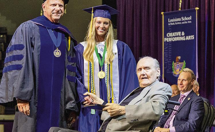 The Louisiana School for Math, Science and the Arts governing board voted unanimously to award former state senator Donald G. Kelly an honorary LSMSA diploma. Standing are Executive Director Dr. Steve Horton and recent graduate and Kelly’s granddaughter Anderson Kelly.