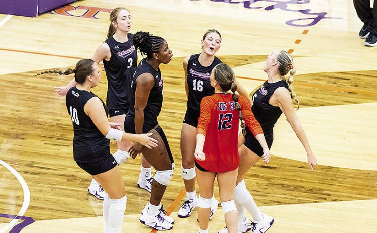 The volleyball team celebrates after win over Alcorn State.