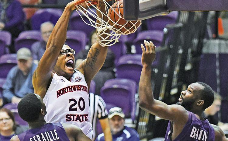 Ishmael Lane (center) dunks during a game against Stephen F. Austin in the 2017-18 season. Credit: Gary Hardamon/NSU Photographic Services