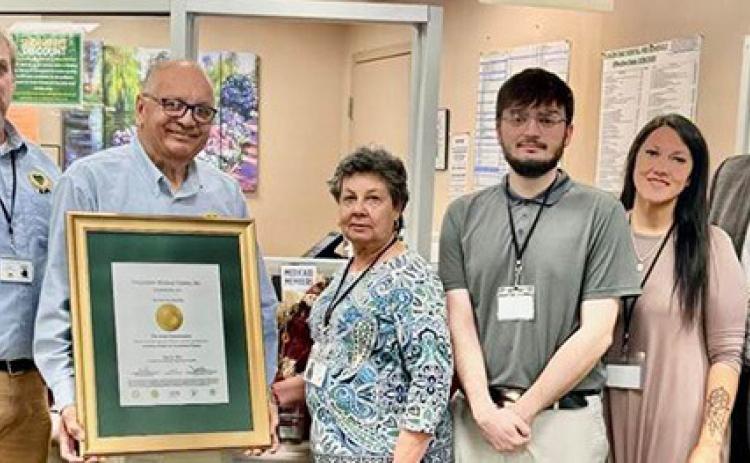From left are Richard Bruce, Board President Thomas Roque, Doris Kochinsky, MSW, LCSW, William Salinas, Brandi Mitchell and CEO/ CMO Dr. Mark Guidry.