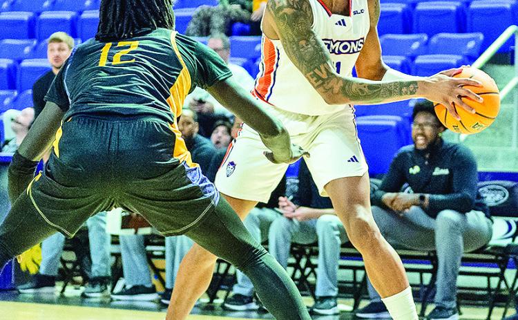 Senior Justin Wilson (right) finished his NSU career with a 20-point, nine-rebound performance against Texas A&amp;M-Commerce on Sunday. Photo by Chris Reich/NSU Photographic Services