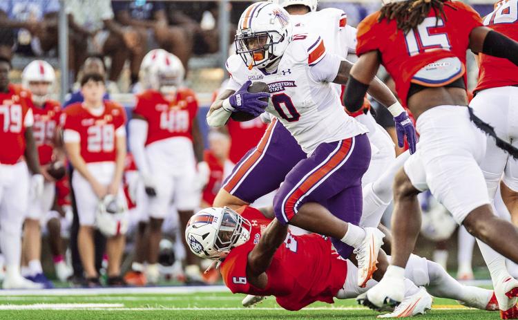Myion Hicks (center) rushed for 69 yards on 12 carries Saturday night. Credit: Chris Reich/NSU Photographic Services
