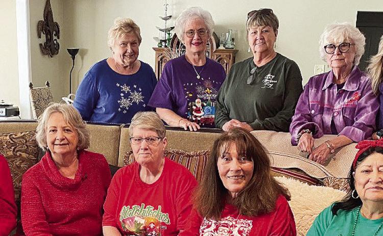 The Natchitoches Red Hat sisters held their Christmas party at Celidora Peltier’s home Dec. 12. Those attending are, seated from left, Carol O’Quinn, Wanda St. Andre, Becky Ham and Liz Durr. Standing are Mary Jane Wright, Donna Masson, Betty Whitehead, Pete McCorkel and Celidora Peltier.