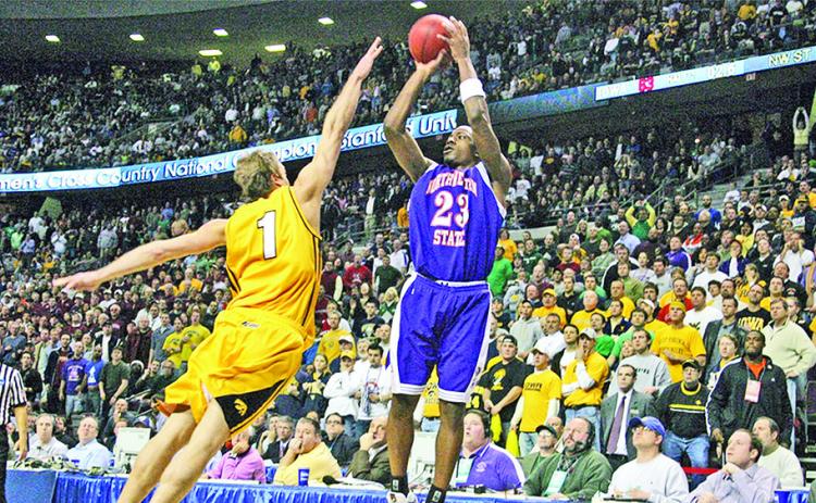 Northwestern State’s Jermaine Wallace releases the game-winning shot over Iowa’s Adam Haluska on March 17, 2006, in the NCAA Tournament. Photo by Doug Daniels