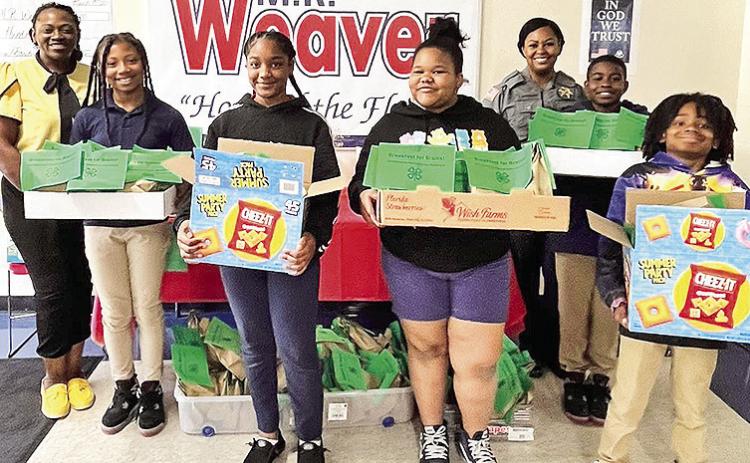 Weaver Elementary 4th grade students are excited to receive “Breakfast for Brains” bags.