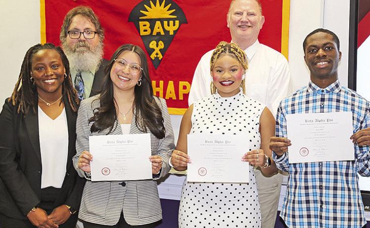 NSU’s Beta Alpha Psi, the honor society of financial information students, inducted new members April 20. On the front row from left are outgoing president Dexteria King with inductees Paulina Trejo, Denae Davis and Joel Hill. On the back row are College of Business faculty Dr. James Smith and Dr. Mark Swanstrom.