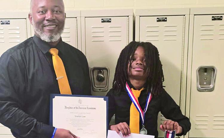Teacher Jermaine Thomas presented the Youth Citizenship Award to Tristian Law, a sixth grader at Natchitoches Jr. High. Thomas is the sponsor of the Boy to Men Cub.