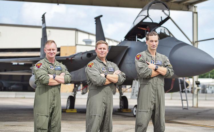 159th Fighter Wing, Louisiana Air National Guard command fighter pilots Lt. Col. Cody “Viking” Clark, commander, 159 OG, Col. David “Ripper” Anderson, commander, 159 FW and Lt. Col. Joshua “Tito” Higgins, deputy commander, 159 FW pose for a photo to commemorate reaching F-15 flying hours milestones at Naval Air Station Joint Reserve Base New Orleans, Belle Chasse, La., Jun. 5, 2024.