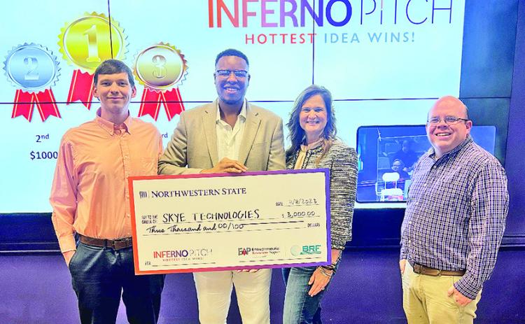 From left are William Anderson of Entrepreneurial Accelerator Program; Pierite, Dr. Mary Edith Stacy, dean of the College of Business and Technology, and Dr. Curtis Penrod, director of the School of Business.