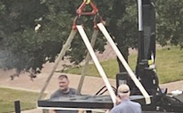 The next in a series of granite memorial slabs is unloaded and installed at the Roque House Preservation Wall. To add a name to the wall, go to RoqueHouse.com and follow the instructions. Cost is a $150 donation to become memorialized as part of Natchitoches history forever.