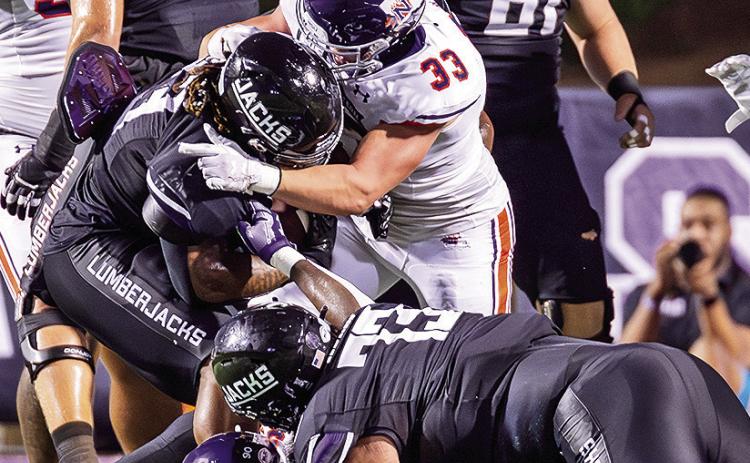 Landry Huddleston (33) recorded a career-high 12 tackles at Nicholls. Photo by Chris Reich/NSU Photographic Services
