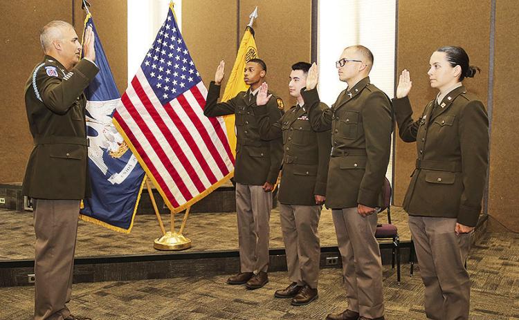 LTC Joshua Drake administered the U.S. Army oath of office to graduating NSU ROTC cadets Christian Holmes, Ethan Jones, Lawson Turner and Layla Wood during a commissioning ceremony for family and friends.