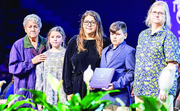 NSU presented a posthumous degree the late Seth R. Stanfield, a Doctor of Nursing Practice student who passed away in April. Accepting the diploma were his wife Christy, their children Madelyn and Landry, his mother Terri Stanfield and mother-in-law Rosie Ebarb.