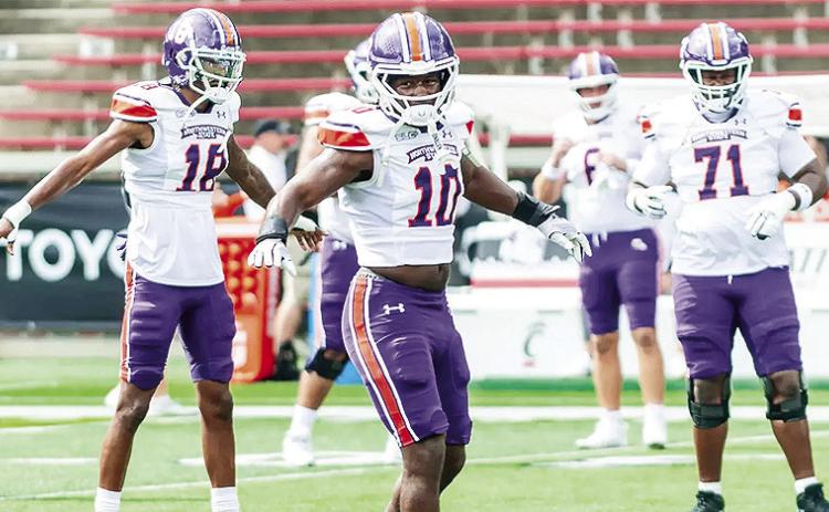 Northwestern State teammates on both sides of the ball are looking to a newcomer, junior college transfer Fernando Washington (10), for leadership. Photo by Brad Welborn, NSU Athletics