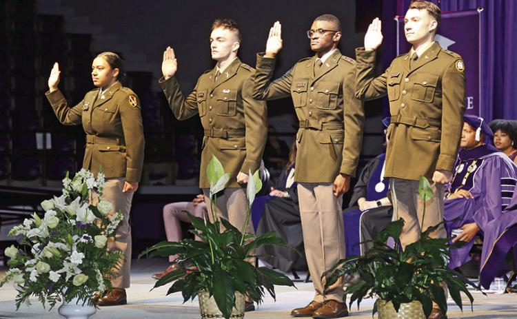 Four graduating seniors from Northwestern State University’s Department of Military Science took the oath of office to serve as second lieutenants in the U.S. Army. From left are 2nd Lt. Breanna James, 2nd Lt. Loren Higginbotham, 2nd Lt. Andrew Wesley and 2nd Lt. Peyton Bordelon. Lt. Col. Joshua Drake, professor of military science, issued the oath during commencement exercises May 9.