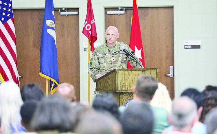 The Louisiana National Guard Assistant Adjutant General Brig. Gen. Michael Greer speaks to Guardsmen, family and friends of the 1021st Vertical Engineer Construction Company.