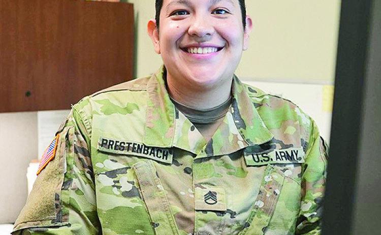 Staff Sgt. Jessica Prestenbach, a human resource supervisor for the Louisiana National Guard, takes a break from processing administrative paperwork for a photo, Sept. 20, 2023. Prestenbach is one of several service members being highlighted during the LANG’s Hispanic Heritage Month social media campaign, Sept. 15 – Oct. 15.