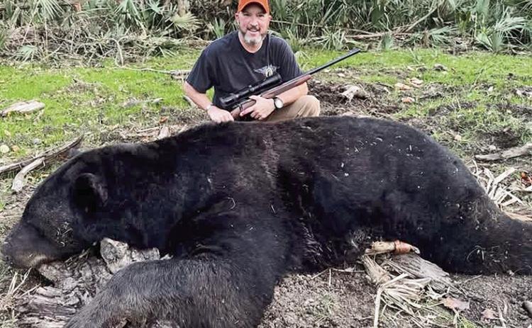 Military veteran and Purple Heart recipient Deron Santiny downed this 696-pound black bear in Tensas Parish. The bear was the largest harvested in Louisiana during the season and the biggest observed in recent history of the Department of Wildlife and Fisheries.