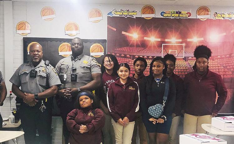 From left are Officer Duruisseau, Lt. Turner, Officer Owusu-Duku, Ronnie Wilson, Fergie Torrecillas, Cadynce Smith, Joshua Jackson, Kayleigh Fox, Kennedy Bradley, Chelsea Robinson and Joshua Lockhart.