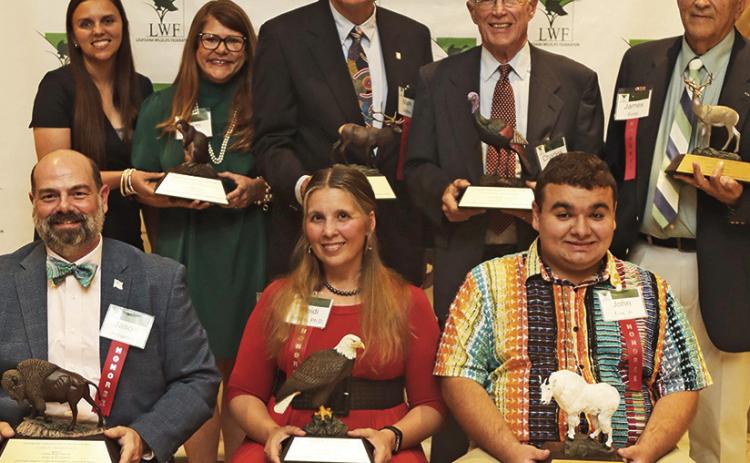 Pictured in the front row, from left, are Jason Adriance, Heidi Adams, and John Fox, Jr. On back row are Natchitoches Parish 4-H agents Amanda Clark and Pam Pierce, Mark Shirley, Charles Williams and James Foret.