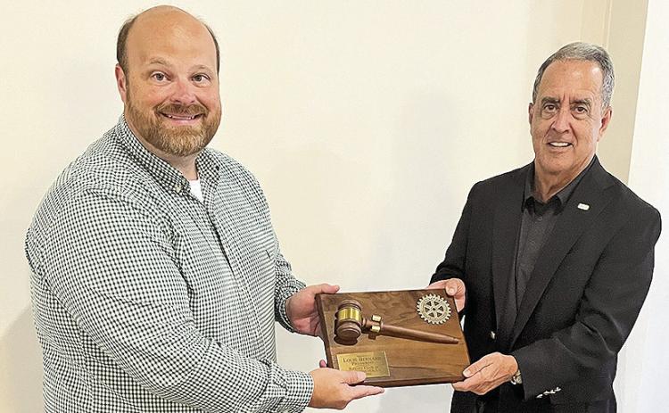 Rotary past-president Louie Bernard, right, was recognized for his leadership this past year with a commemorative plaque presented to him by new president Josh Manuel. Bernard handed his president’s gavel to Manual at the club meeting Tuesday.