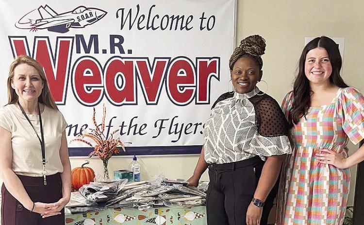BOM purchased new uniform pants from Posey’s Sports Center to donate to M.R. Weaver Elementary School to students in need. The school is accepting new or gently used uniform pants size 6-10 from community members who would like to donate. From left are Shelli Adams, Armetrice Williams and BOM’s Zoe Johnson.