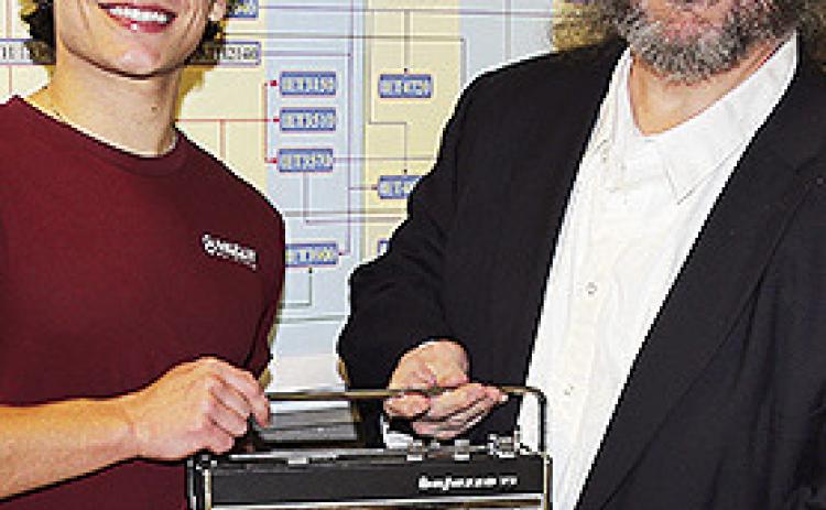 Engineering Technology student Hayden Alberes, at left, of Pierre Part repaired a 1960s Telefunken shortwave radio that belonged to the father of NSU Professor of History Dr. Charles Pellegrin.