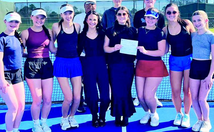 BOM made a donation to the St. Mary’s Catholic School tennis program. Pictured left to right: First row L to R: AK Sheffield, Peyton Faucheaux, Molly Smith, BOM’s Abby Williams &amp; Mary Anna Scruggs, Ainsley Armstrong, Ava Gill, and Jolee Shea. Second row L to R: Coach Willie Paz, Joseph Sklar, and Jackson Godfrey. Not pictured: Camille Armstrong and Peter Kautz.