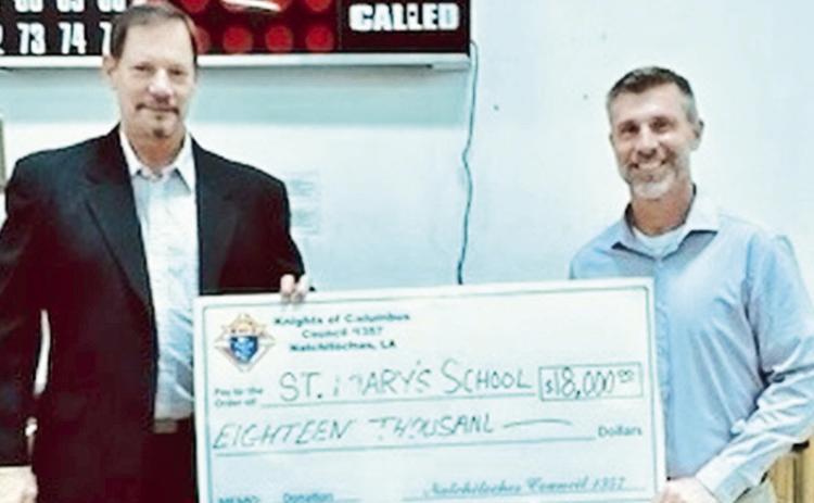 Natchitoches Knights of Columbus Grand Knight Ted Duggan recently presented St. Mary’s School Principal Stephen Wren with a donation of $1,500 providing the last payment on the Knights’ pledge of $18,000 in 2023. The Natchitoches Knights have been a supporter of St. Mary’s School for over 100 years. From left are Duggan and Wren.
