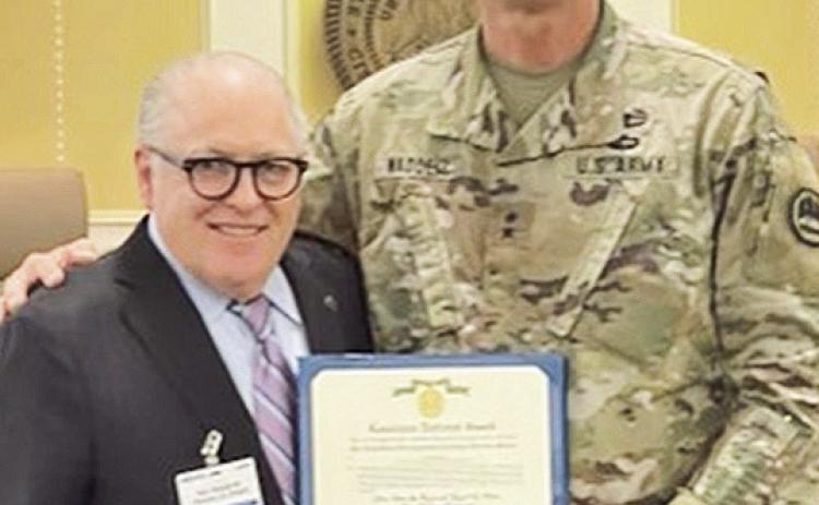 Maj. Gen. Keith Waddell presents Distinguished Civilian Service Medal to Economic Development Secretary Don Pierson.