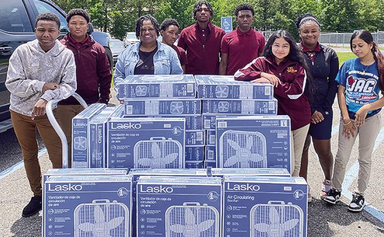 Demonstrating compassion and a commitment to community ser- vice, the Natchitoches Junior High JAG members recently donated box fans to the Natchitoches Council on Aging. With rising temper- atures approaching, the donation aims to provide comfort and relief to local senior citizens during the warmer months. The JAG mem- bers took initiative in organizing and contributing to this effort, showing a deep understanding of the importance of giving back to those in need.