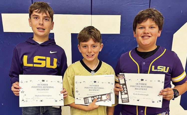 St. Mary’s students, from left, Hudson Harrington, Hendrix Harrington and Noah Scarborough, showed incredible school pride by stepping up to clean up after the homecoming Powder Puff game, earning them a Positive Behavior Referral.