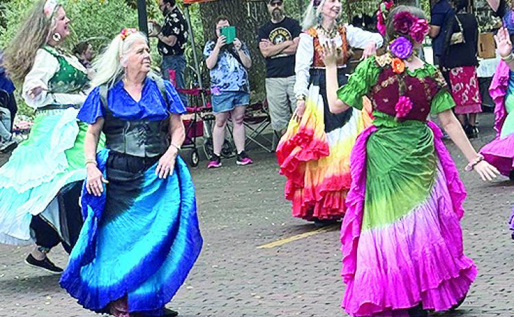 Local artists gathered along the historic bricks to welcome spring with their unique handcrafted pieces. Pictured are Indigeaux and Begindigeaux, Natchitoches’ belly dancing groups, who performed on the bricks in front of the Natchitoches Art Galley at Art Along the Bricks. The group performed to the music of the Rhythm Warriors comprised of veterans of friends.