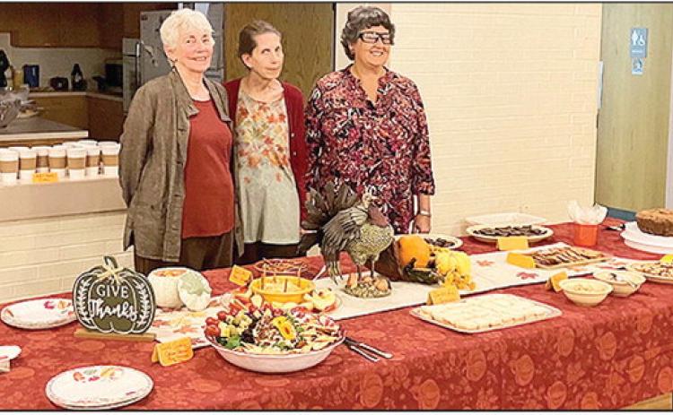 Hostesses Alice Bryant, Gilen Norwood and Pam McCalister with their beautiful refreshment table