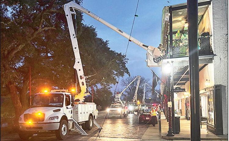 City of Natchitoches Utility Department crews take down its famous lights at the corner of Front Street and Touline Wednesday night, marking the end of Christmas Festival and the beginning of Mardi Gras season which runs through Feb. 17.