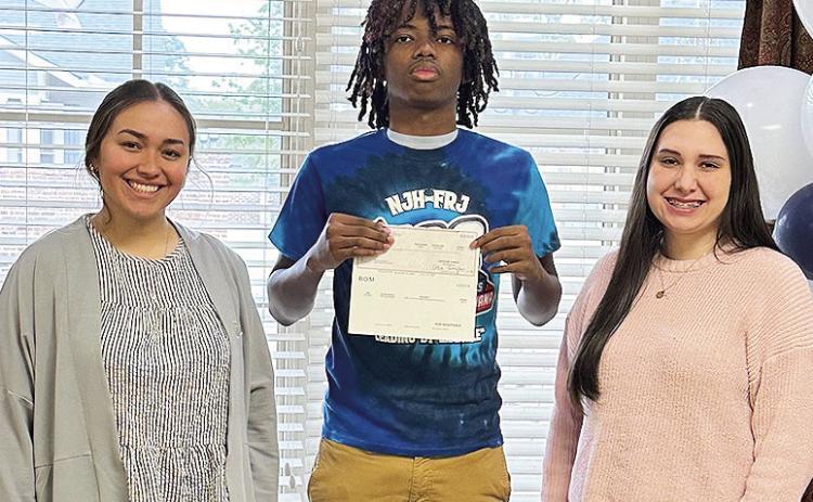 BOM wll sponsor a Natchitoches Jr. High student, Ta’Jarrius Bowers, when he attends the JAG National Career Development Conference April 24-27. From left are BOM’s Syddah Shults, Bowers and BOM’s Gracie Borders.