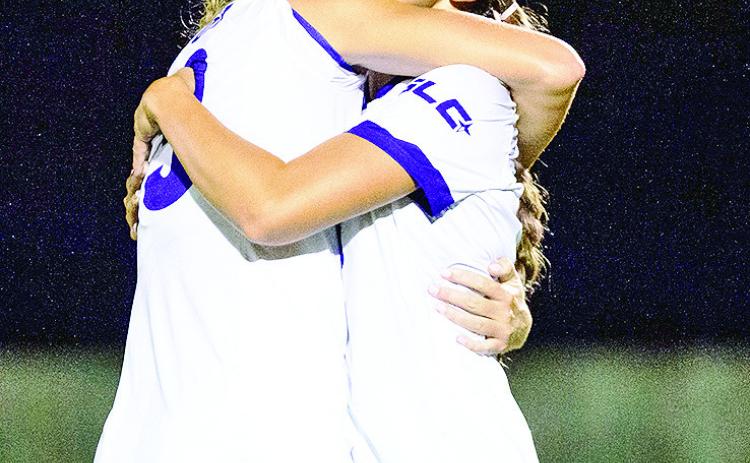 Kendall Hemperley (left) and Dawson Marrs celebrate Northwestern State’s first goal in a 20 victory over visiting Texas A&amp;M-Corpus Christi on Thursday evening at the Demon Soccer Complex. Photo by Chris Reich, NSU Photographic Services