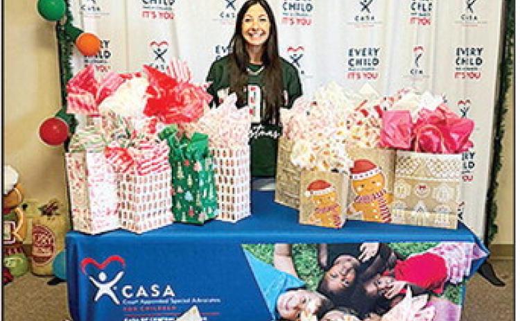 BOM Bank filled several wish lists from the CASA of Central Louisiana’s Angel Tree. BOM’s Micah Murchison is pictured with the donations.