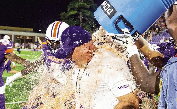 Players douse Northwestern State head coach Blaine McCorkle with orange Powerade following Thursday’s win against Alcorn State. Photo by Chris Reich/NSU Photographic Services