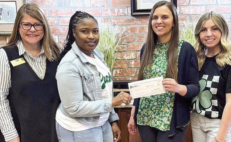 BOM was proud to support the Natchitoches Parish 4-H Foundation. The donation was to help with their annual Friends of Natchitoches 4-H Auction &amp; Banquet. Pictured from left are Pam Pearce, BOM’s Shonterika Payton, Amanda Clark and BOM’s Meagan Graves.