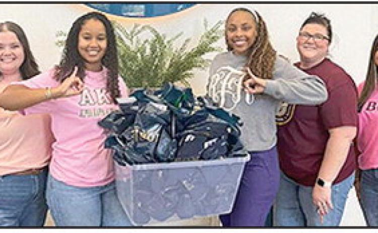 BOM bank donated 55 goodie bags to the Alpha Kappa Alpha Sorority, Inc. —Rho Beta Omega &amp; Eta Chi Chapter’s Denim and Pearls Leadership Brunch. From left are BOM’s Nicole Williams and Marie Nelson, Raven Fields, BOM’s Angela Taylor and Genevieve Loe.