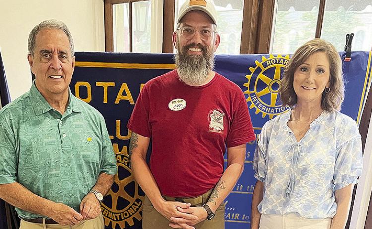 Rotarian with the Program Rhonda Jones introduced the owner and creator of Dark Woods Adventure Park Jason Summerling at the May 13 Rotary luncheon at Merci Beaucoup. Summerling shared his past, present and future visions of the park for family fun. From left are Rotary President-elect Louie Bernard, Summerling and Jones.