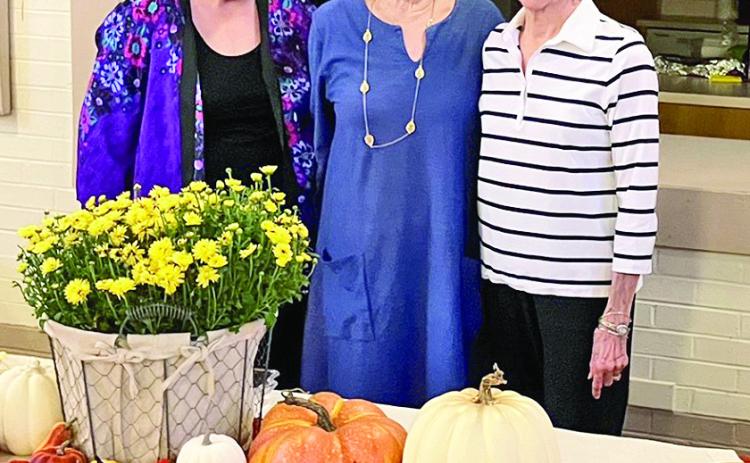 Hostesses were, from left, Barbara Gillis, Sue Keller and Adele Scott.