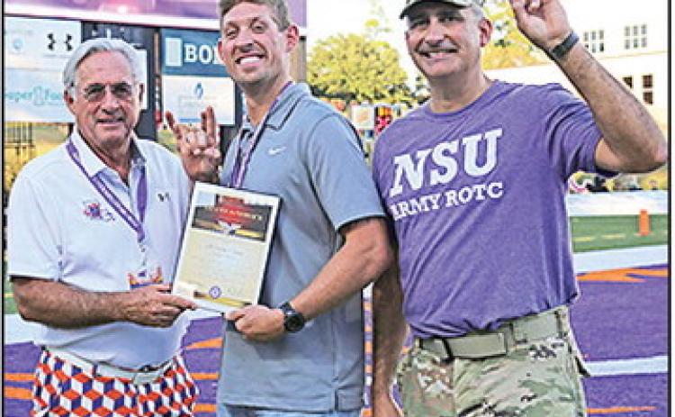NSU welcomed Captain Gavin Bazer as the honorary guest captain during the Demon Football Homecoming game Oct. 4. From left are NSU President James Genovese, Bazer and LTC Joshua Drake, head of NSU’s Department of Military Science.
