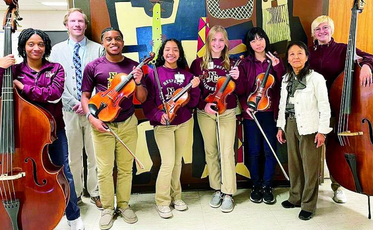 The Natchitoches Central High School students were selected to be in the 2025 La.Music Educators Association Allstate orchestra and will perform in New Orleans on Jan. 18. This is a prestigious honor for orchestra members across the state. From left are Macyn Lacour, Instructor Lincoln Hall, Christian Frazier, Ana Campos, Natalie Hyde, Yujun Yao, Conductor Syll-Young Olson Young and Ripplie Perkins.