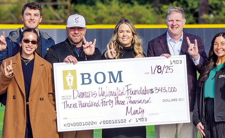 Northwestern State Assistant Athletic Director for Corporate Partnerships and Development Scott Maggio, BOM’s Ragan Hale, BOM’s Donovan Ohnoutka, NSU head baseball coach Chris Bertrand, BOM’s Carrie Hough, NSU Director of Athletics Kevin Bostian, BOM’s Micah Murchison, Claire Mayeaux and Mary Scruggs present a check for the new scoreboard at Brown-Stroud Field. Credit: Emily Zering/NSU Athletics.