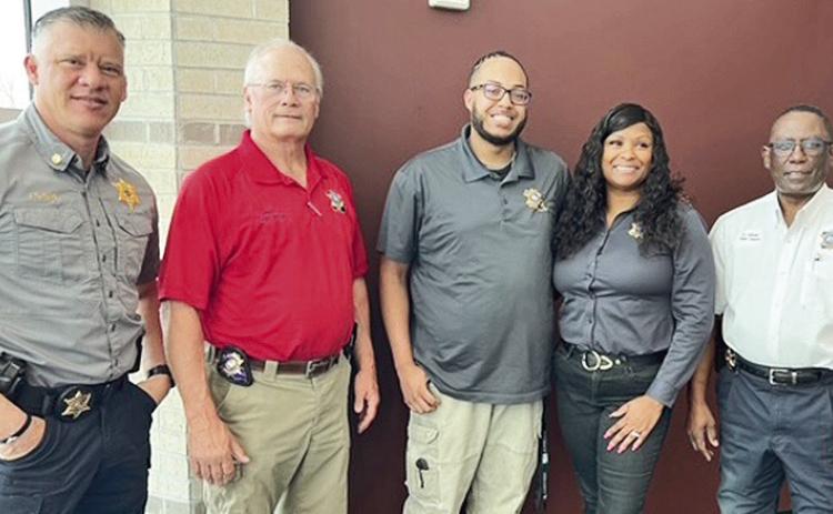 January Deputy of the Month is Dep. II Zharvis Milsap. From left are Patrol Major Jessie Titaino, Sheriff Stuart Wright, Milsap, Director of Communications LaQuita Collins and Chief Dep. Darrel Wynder.